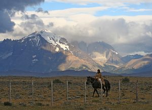 Woman riding horse in Patagonia