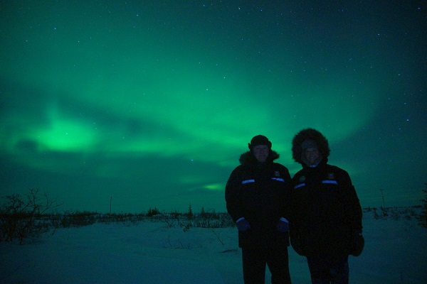 A couple under the northern lights