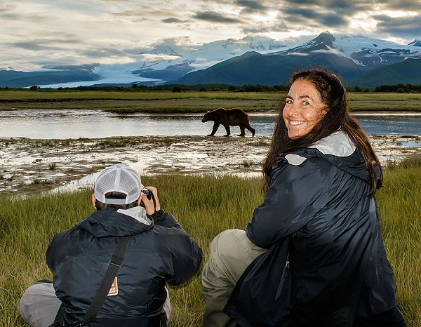 Wendy Klausner Komarnitsky with a wild bear in Alaska