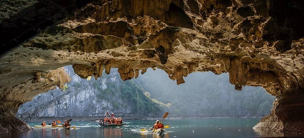 Kayaking down river in cave.