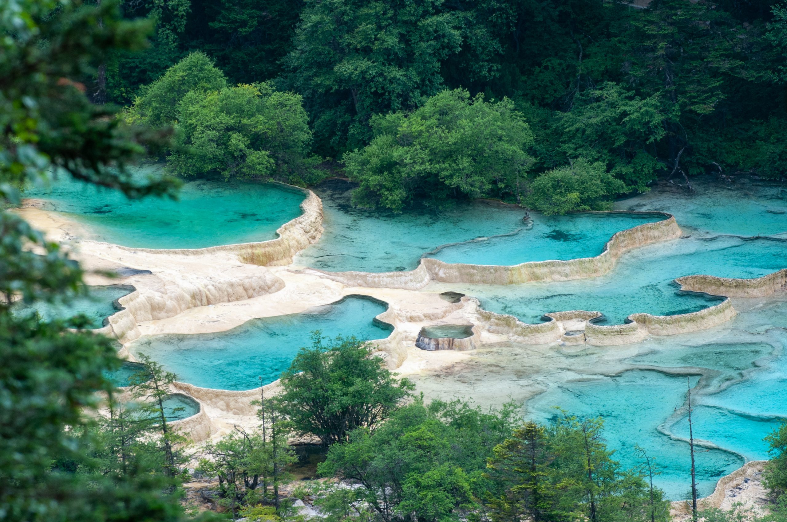 Huanglong Scenic Area in Sichuan Province, China, famous for its colorful travertine pools