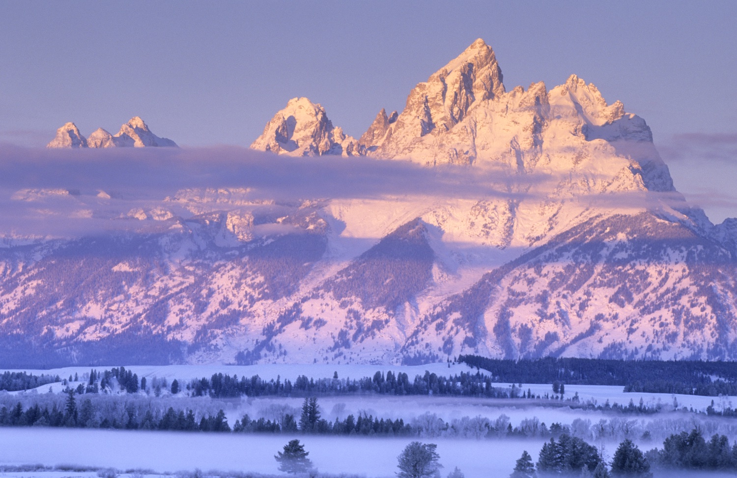 The Teton Range at sunrise from Snake River Overlook on a snowy winter morning. Grand Teton N.P.