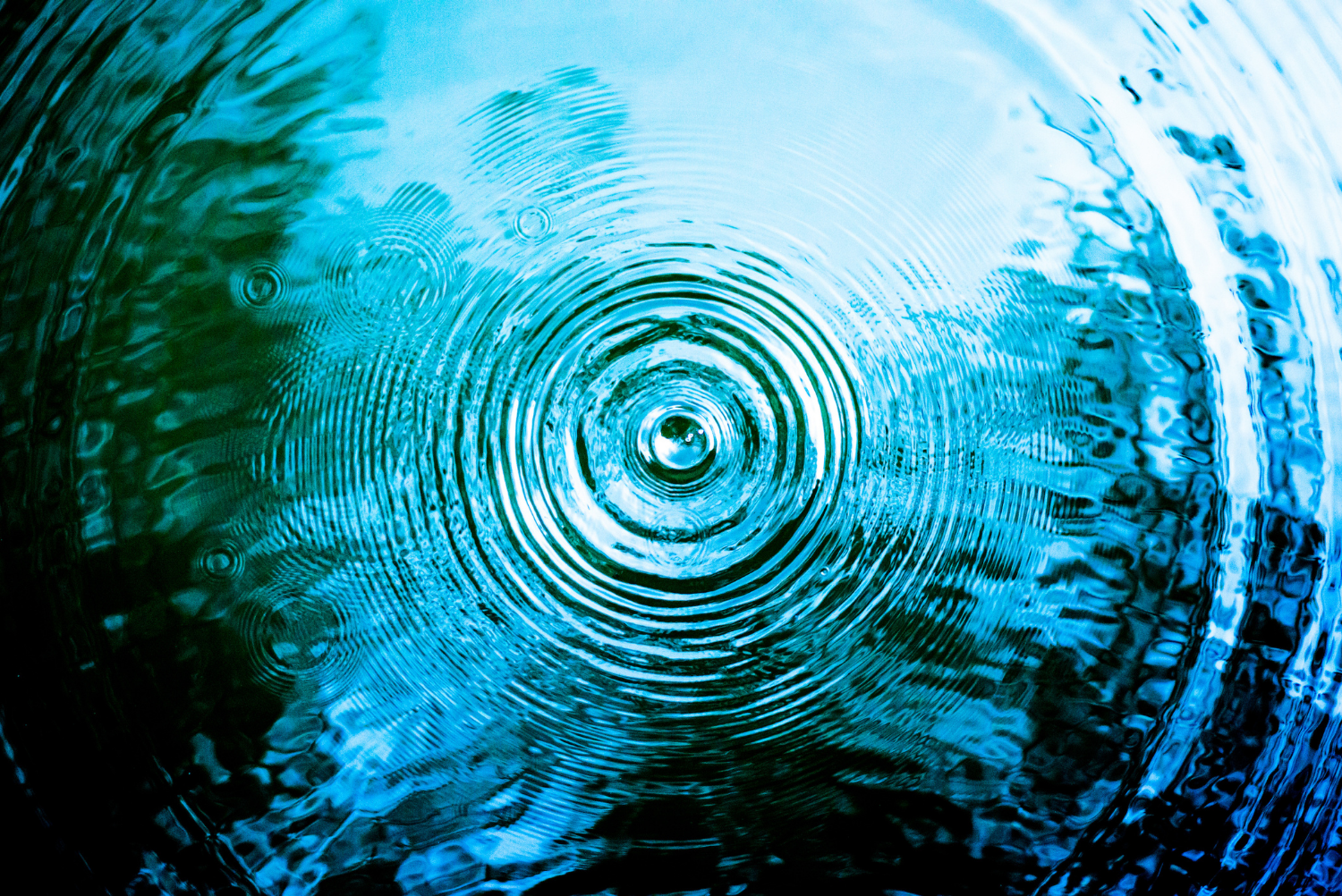 Top view Closeup blue water rings, Circle reflections in pool.