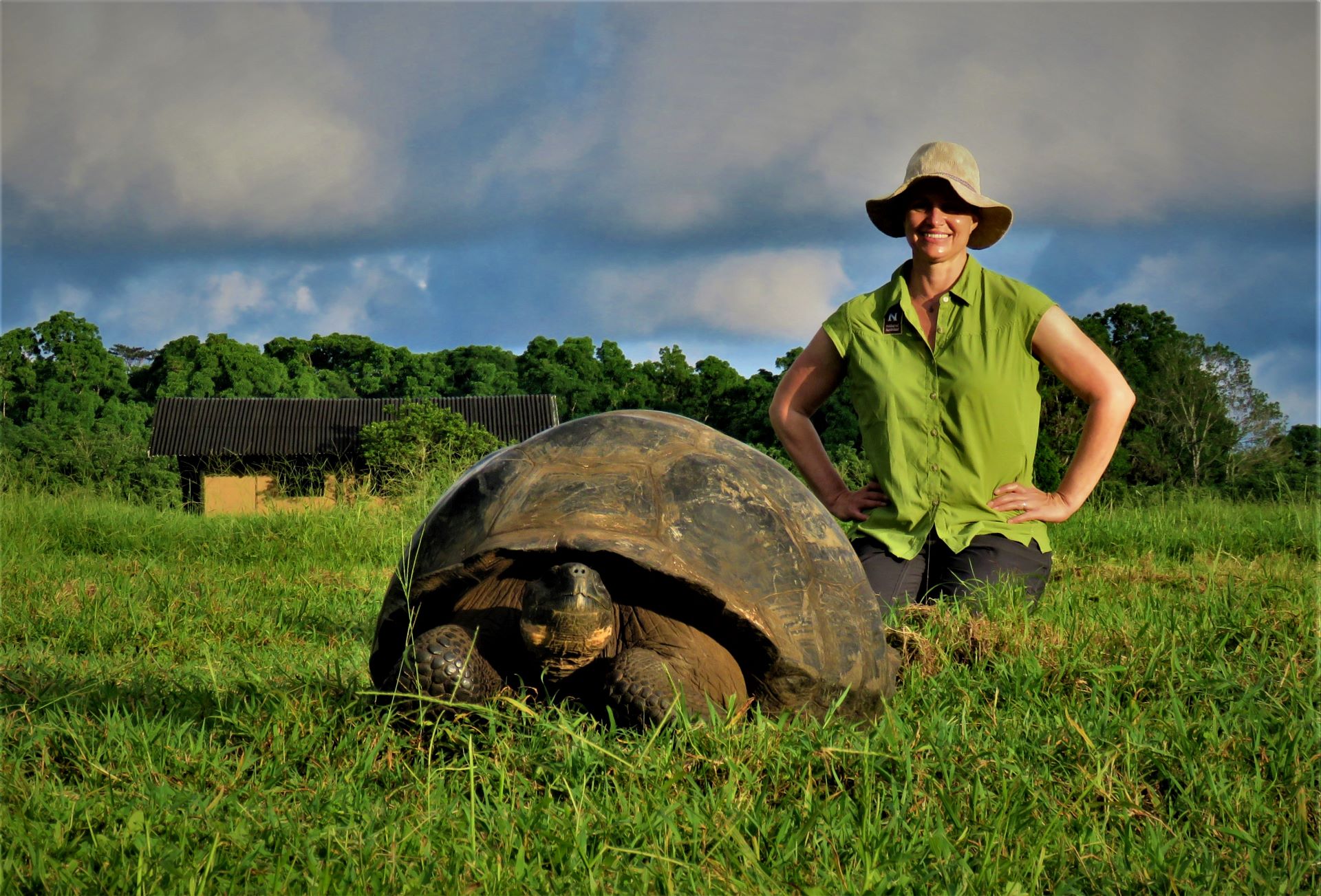 A guide standing close to a giant Tortoise