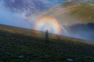 brocken spectre green rolling rocky hills