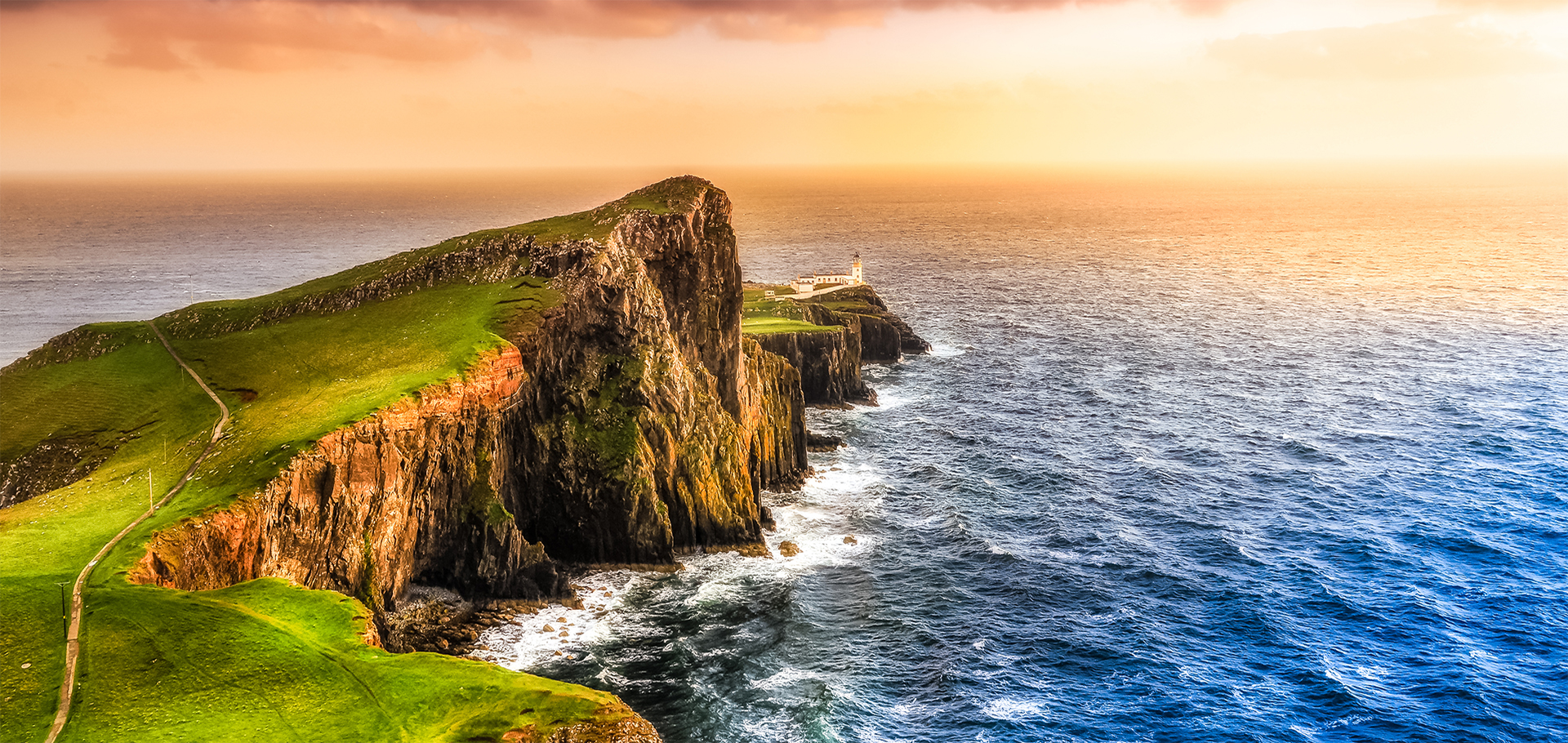 Colorful ocean coast panoramic sunset at Neist point lighthouse, Scotland, United Kingdom