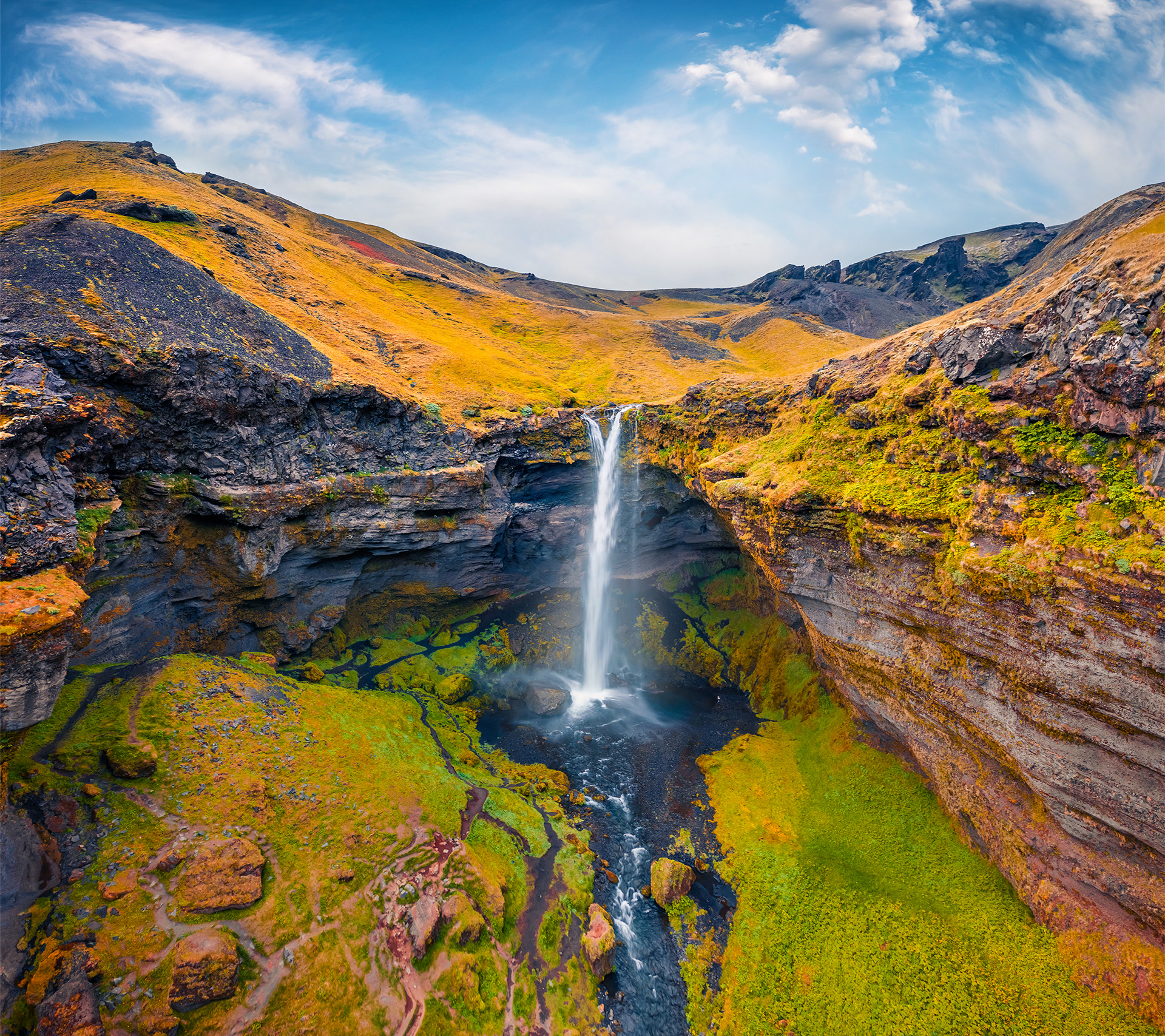 Aerial landscape photography. Awesome summer view from flying drone of Kvernufoss waterfall. Superb morning scene of pure water river in Iceland, Europe. Beauty of nature concept background.