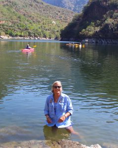 Natural Habitat Adventures guide directing kayakers into the Douro River in Portugal