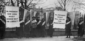 Women protesting for suffrage. Via Library of Congress (LC-USZ62-31799). Women protested silently in front of the White House for over two years before the passage of the Nineteenth Amendment. Here, women represent their colleges as they picket the White House in support of women’s suffrage. 1917.