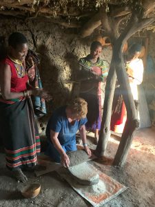 elderly woman visits east african community on safari