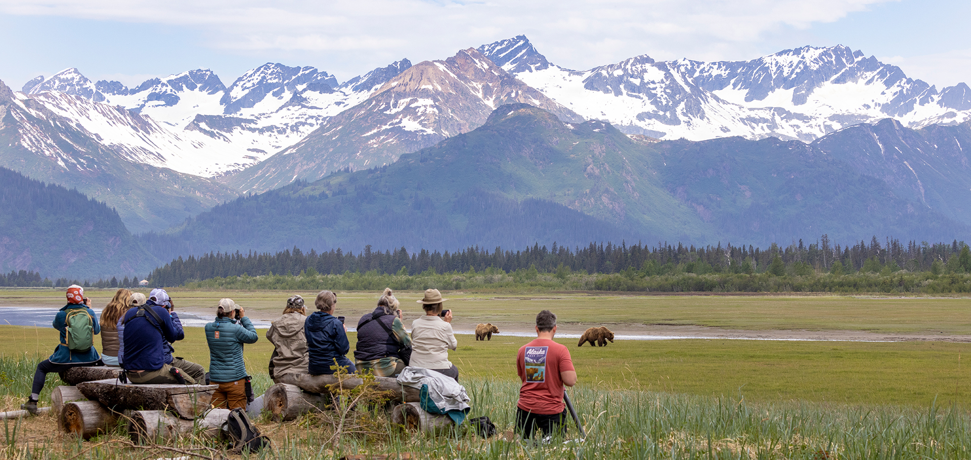 Natural Habitat Adventures Expedition Leaders and travelers watch for brown bears grizzly bears in Lake Clark National Park on a trip to Alaska Bear Camp