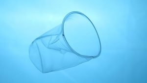 Plastic cup floating in the ocean