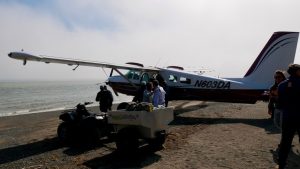 Small plane with people at Bear Camp, Alaska