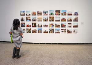 Woman admiring artwork at WAG-Qaumajuq