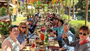 Mexico Monarch group at dinner smiling