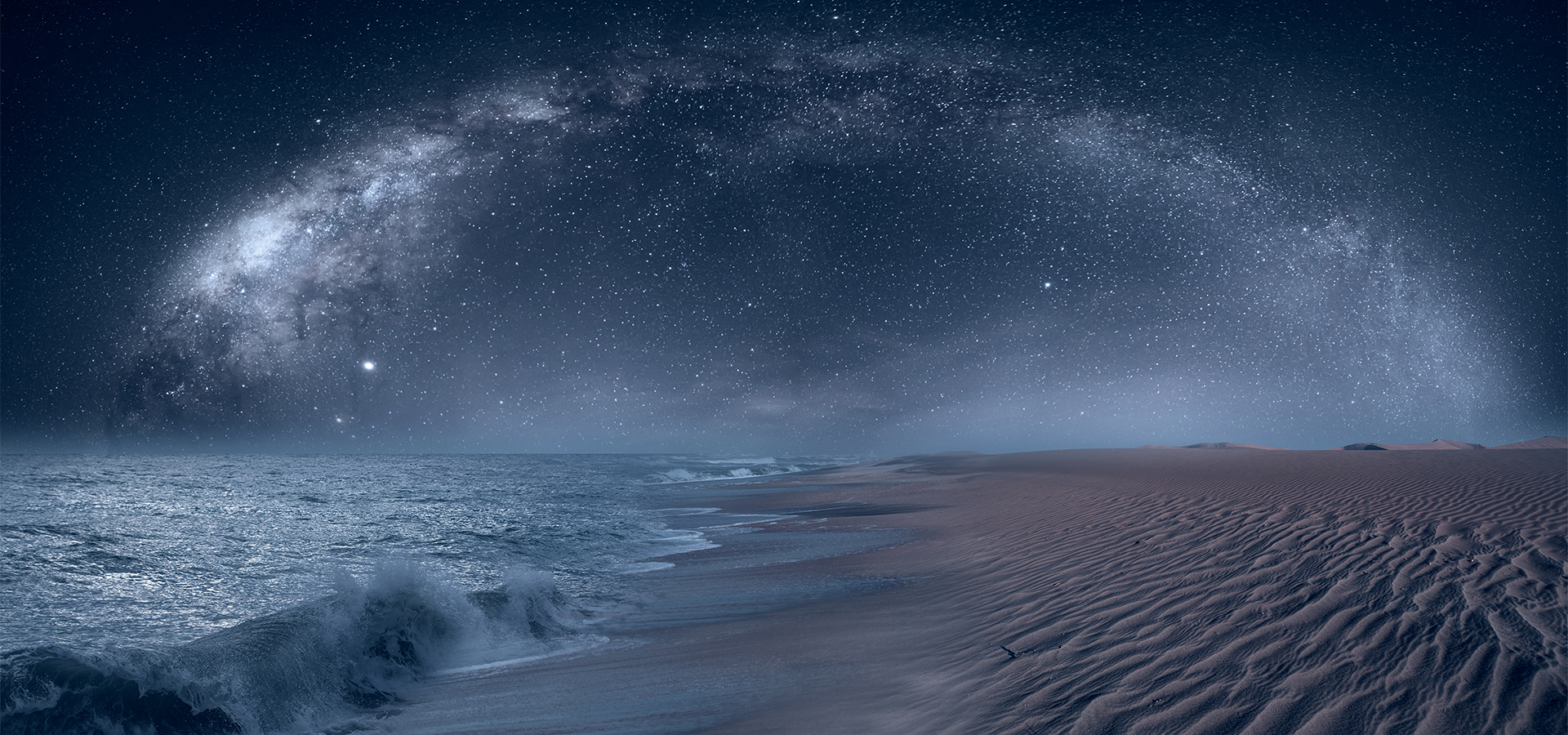 Namib desert with Atlantic ocean meets near Skeleton coast with Milky Way galaxy - Namibia, South Africa