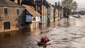 Rescue workers used boats to navigate the floodwater in the centre of York after the River Ouse burst its banks.