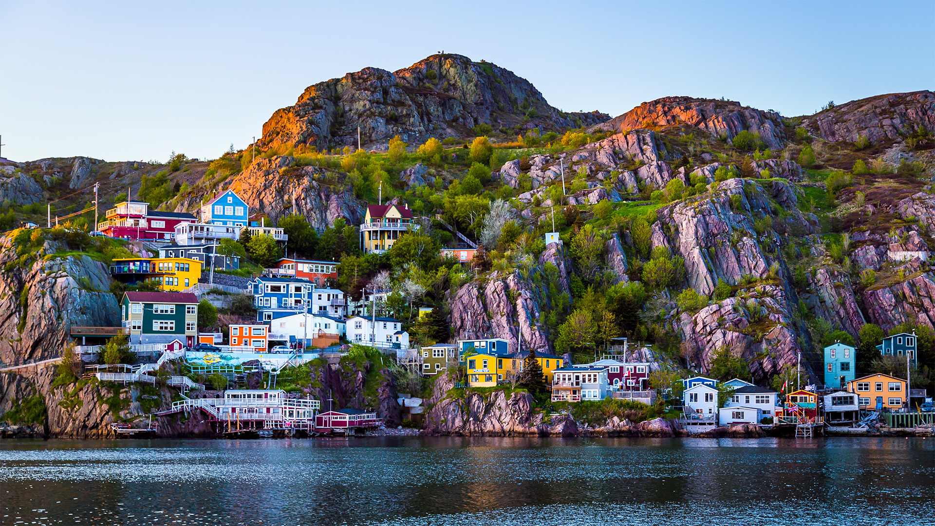 The Battery Road jelly bean homes on the rocky shores of St John's Harbour in Newfoundland Canada