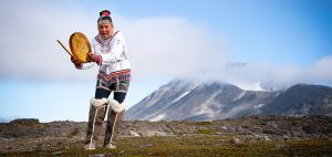 Greenland woman Inuit Indigenous dance cultural drum Greenland Greenlandic Arctic community