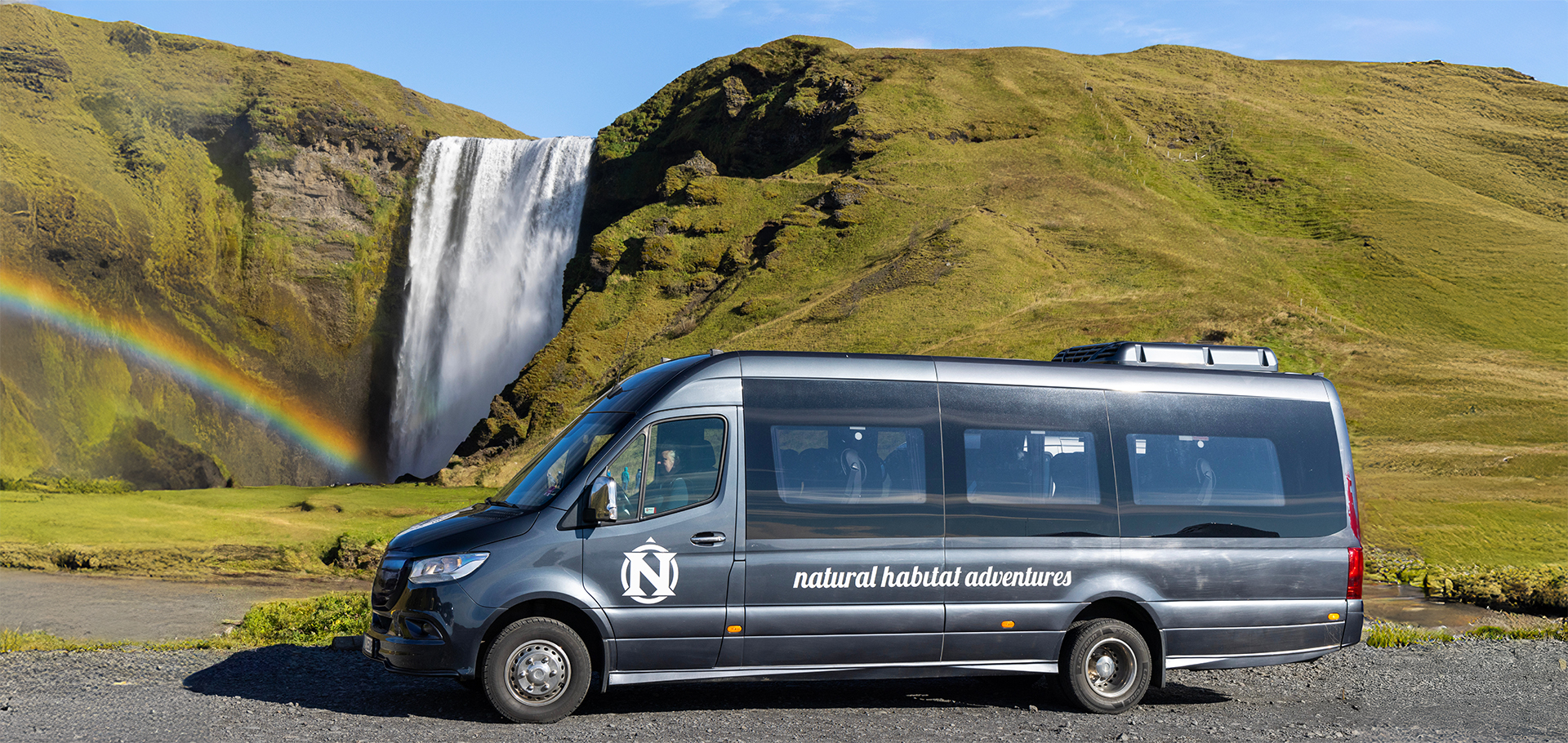 sprinter van Iceland waterfall rainbow