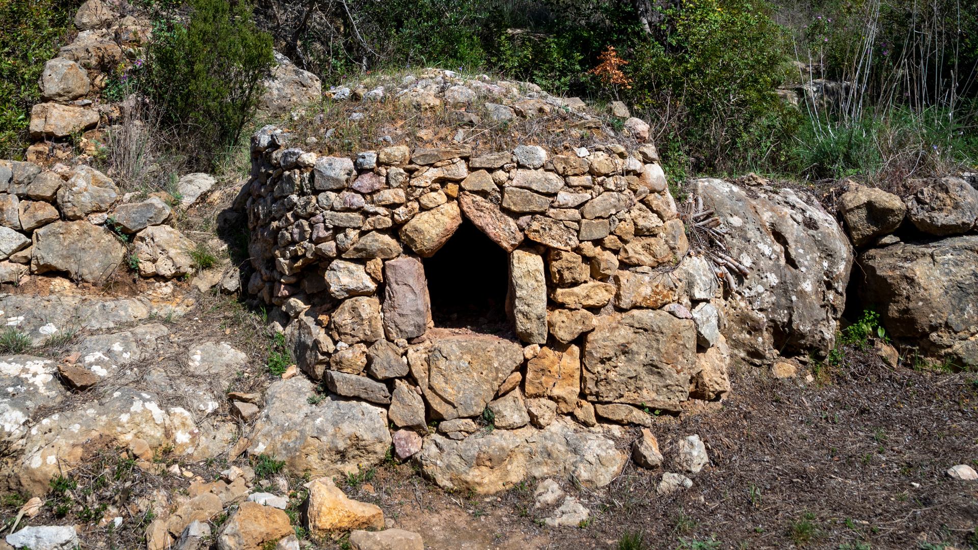 old stone bread oven in the valley of Paderne, Algarve, Portugal